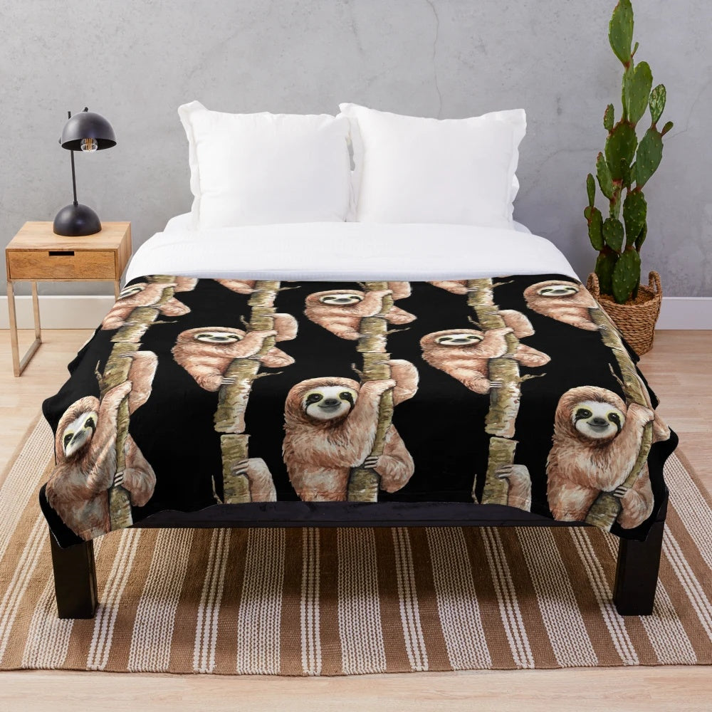 Soft and plush sloth-themed blanket with sloth sitting on a tree branch