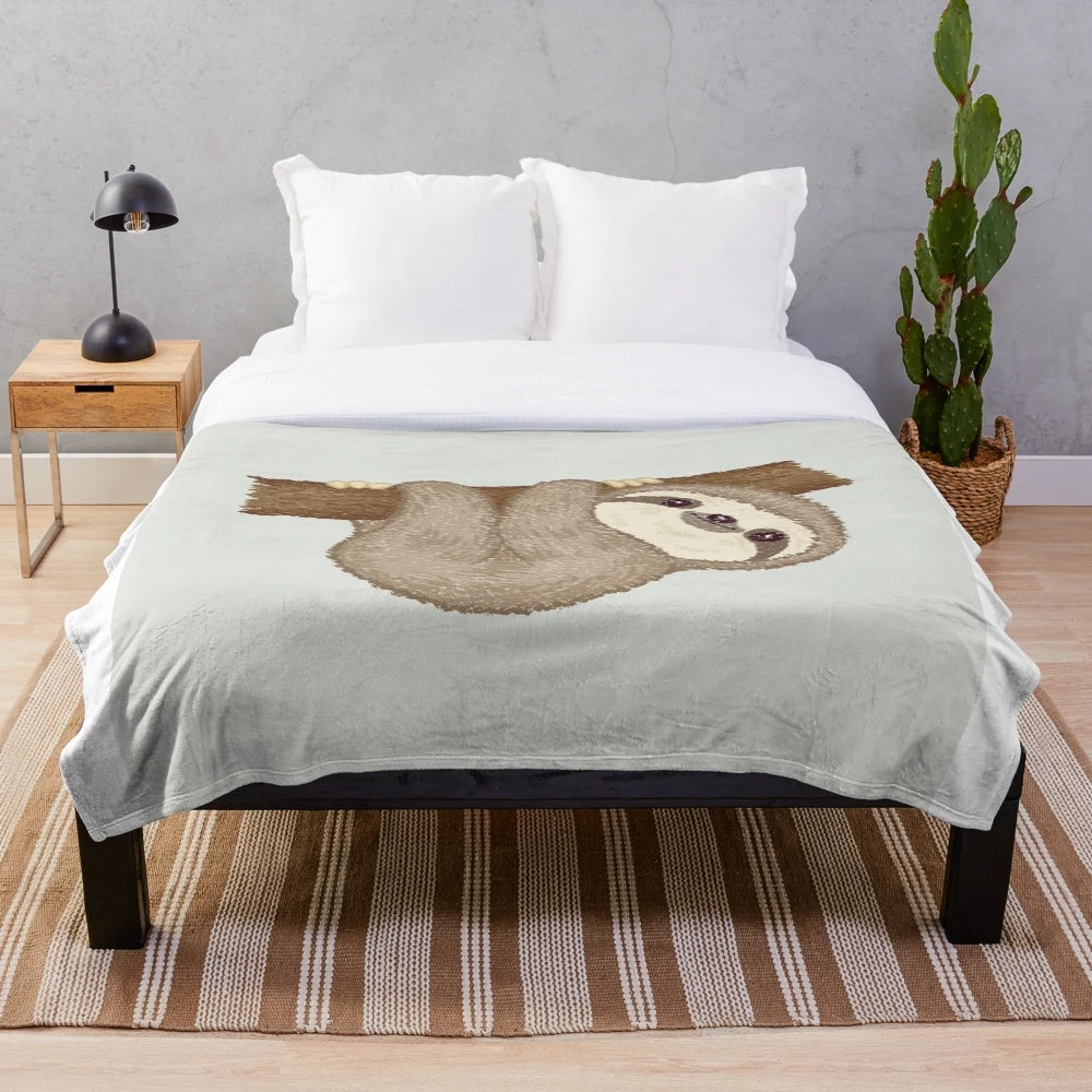 Soft and cuddly sloth plush blanket with a tree design