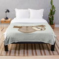 Soft and cuddly sloth plush blanket with a tree design