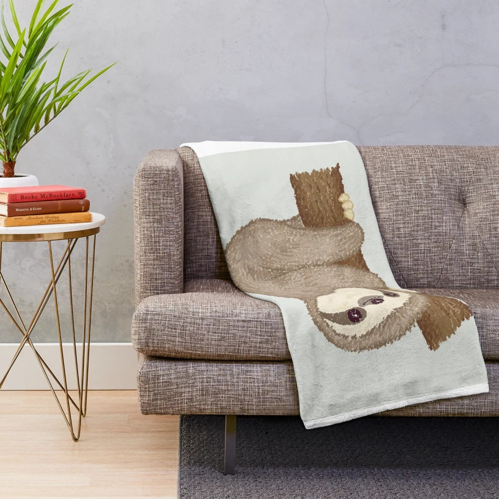 Soft and cuddly sloth plush blanket with a tree design