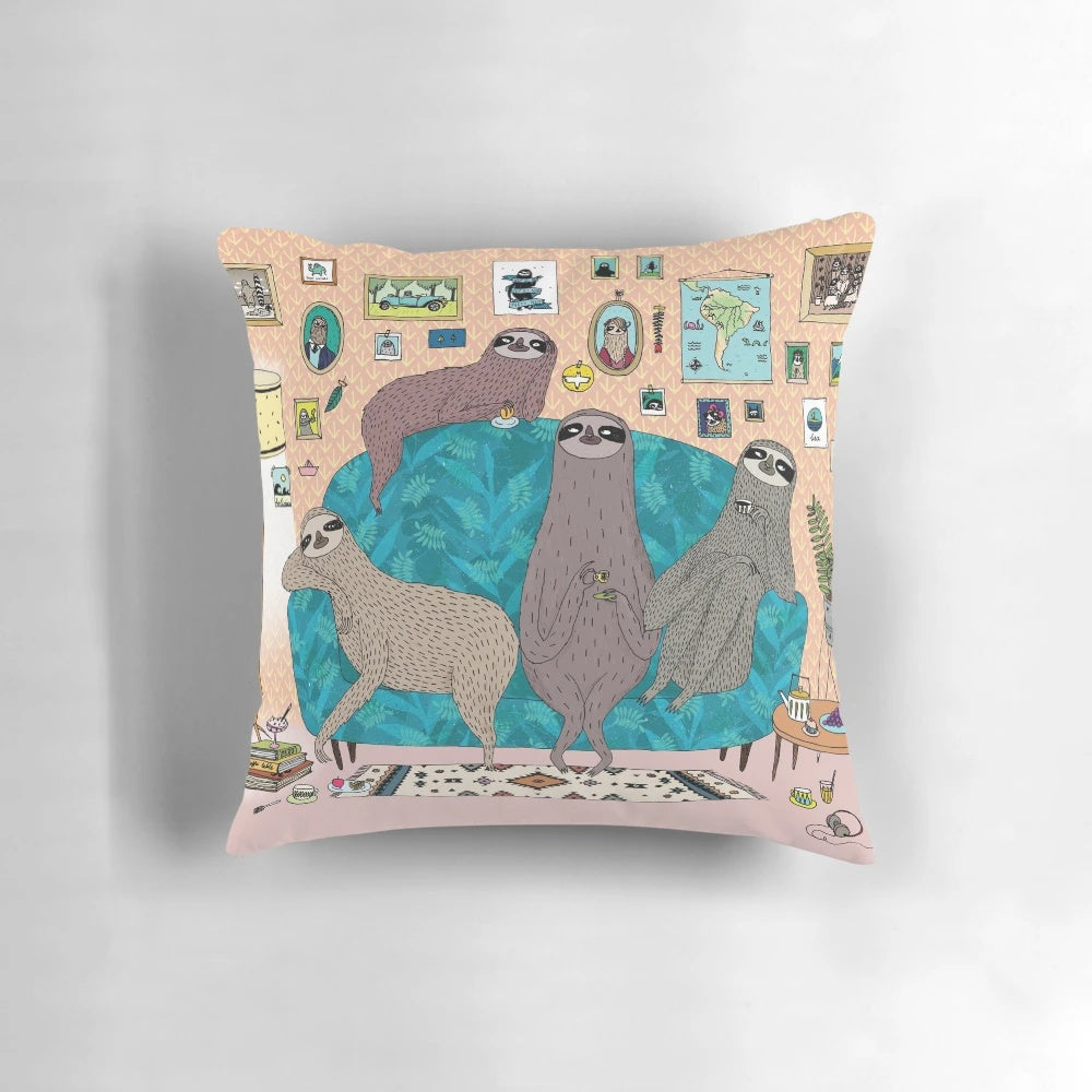 Plush sloth-printed pillow in pastel and neutral tones