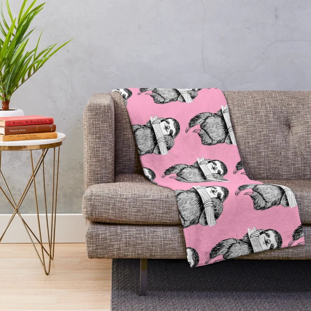 Sloth Plush Blanket with a Hanging Sloth on a Carnation Pink Background