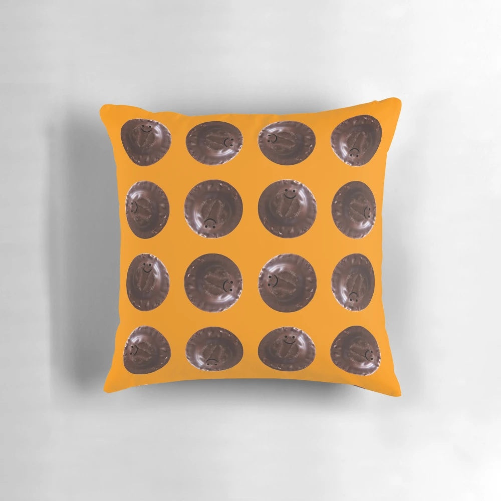 Soft, plush pillow in the shape of a small Jaffa Cake, featuring a chocolate and orange design.
