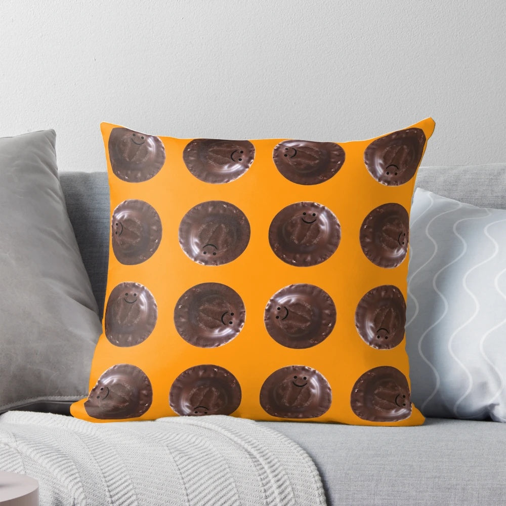 Soft, plush pillow in the shape of a small Jaffa Cake, featuring a chocolate and orange design.