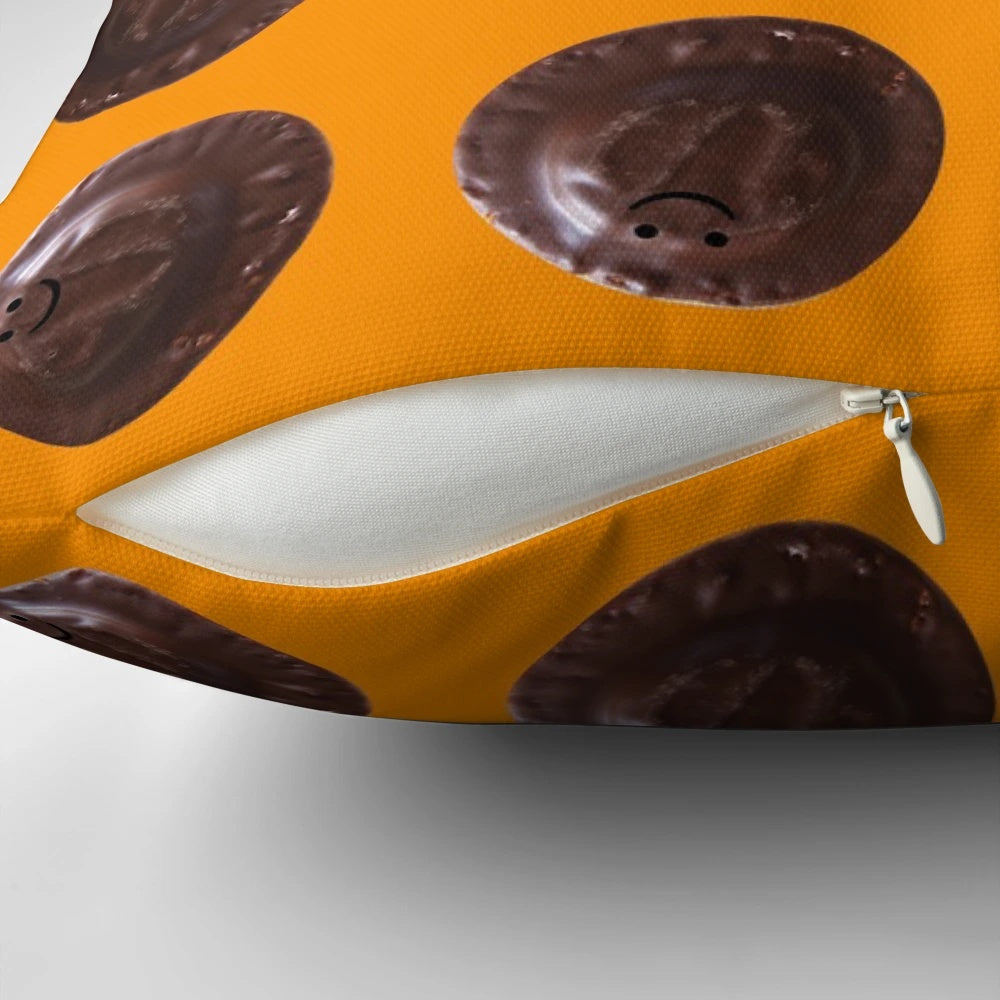 Soft, plush pillow in the shape of a small Jaffa Cake, featuring a chocolate and orange design.