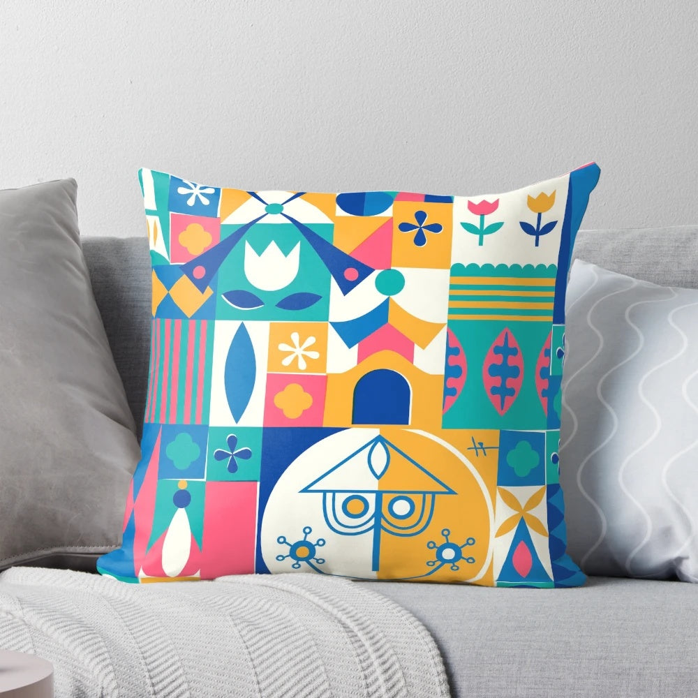 A soft, plush pillow featuring a whimsical "Small World" design, perfect for Disney and theme park enthusiasts.