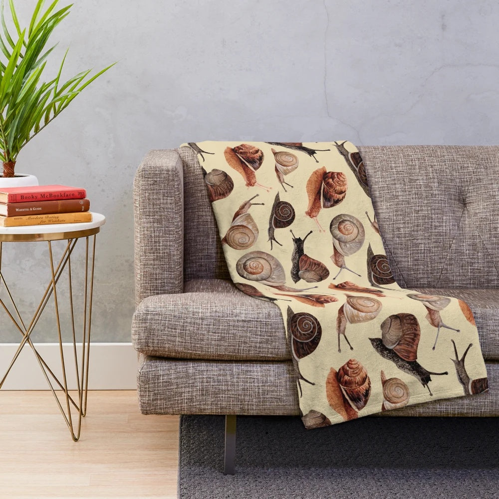 Snail plush blanket with shell and nature inspired design