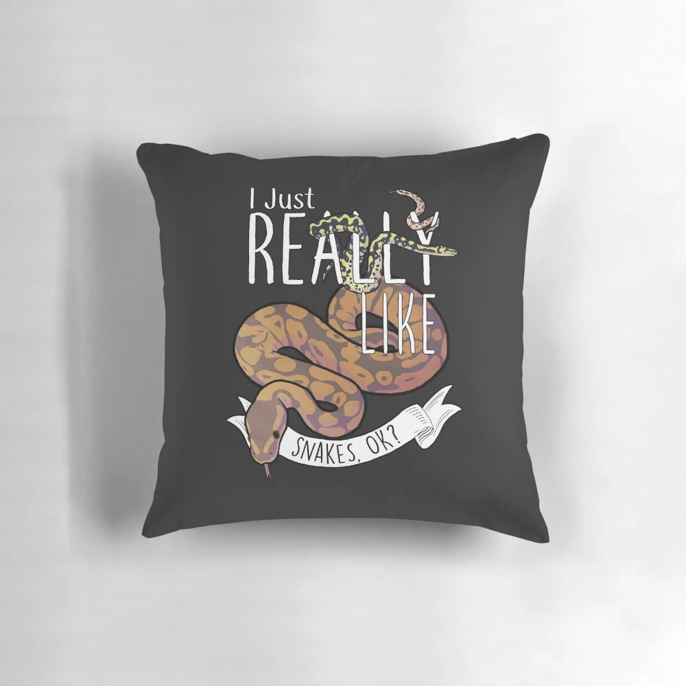 A plush, decorative pillow featuring a playful snake design, perfect for snake lovers and reptile enthusiasts.
