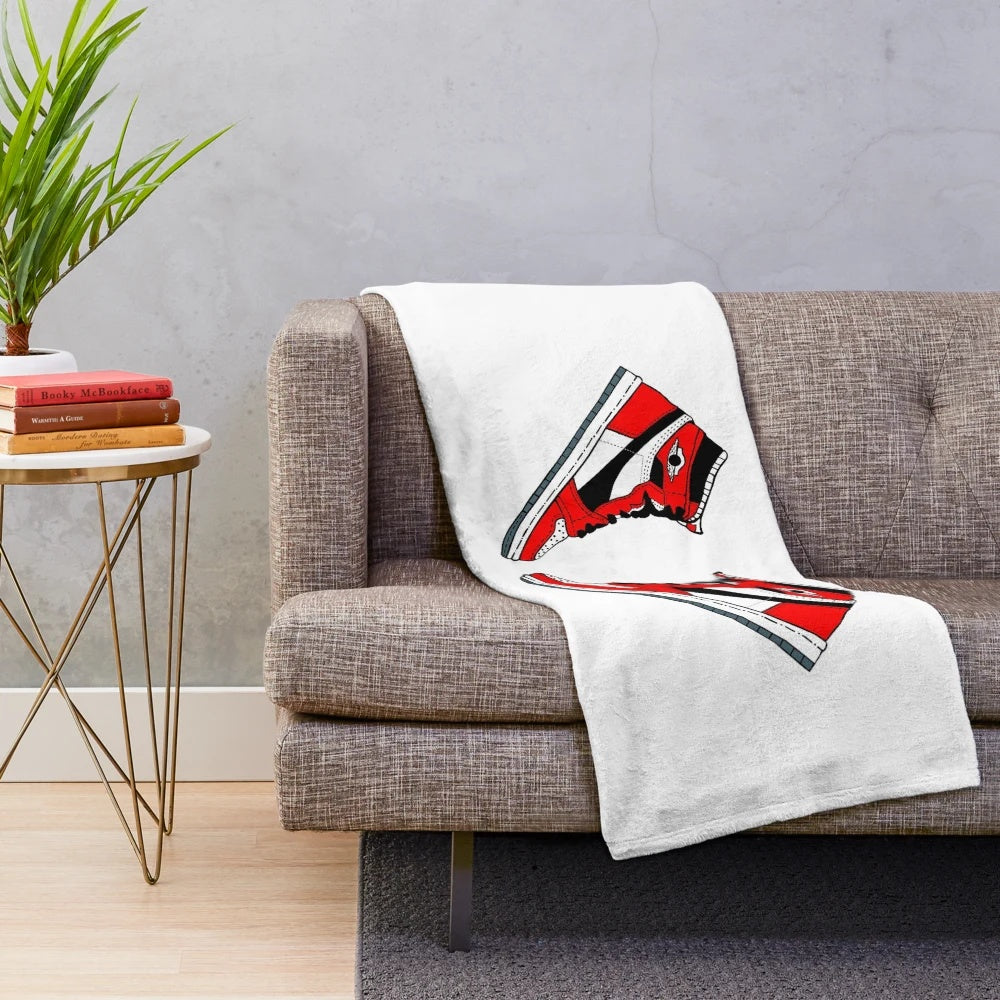 Sneaker plush blanket featuring various sneaker designs