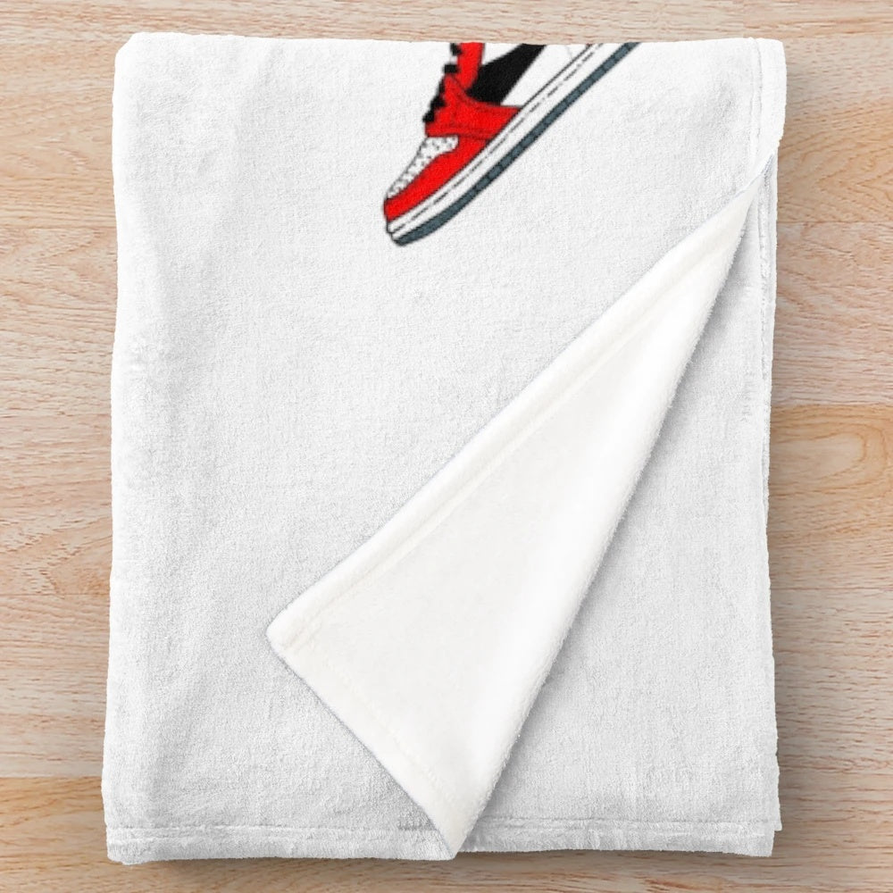 Plush blanket with sneaker design and colors
