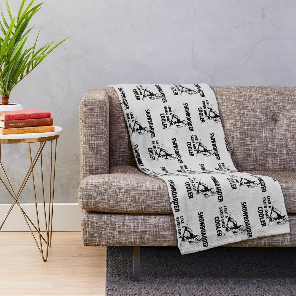 Plush blanket featuring a snowboarder design