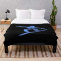 Snowboarding silhouette on plush blanket with snowy mountains