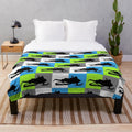 Snowmobile silhouette design on a colorful checkered pattern plush blanket