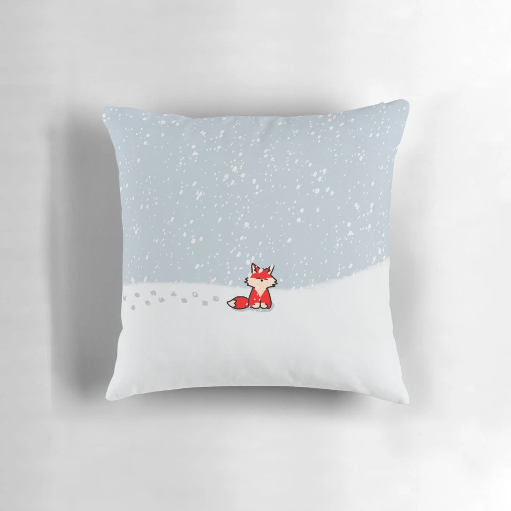 A soft, plush pillow featuring a cute red fox nestled in the snow, perfect for adding a touch of winter wildlife to your home.