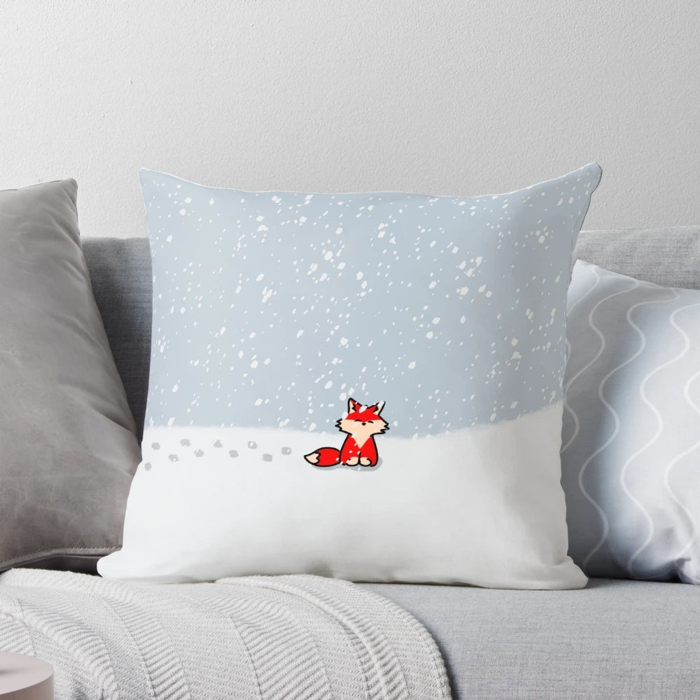 A soft, plush pillow featuring a cute red fox nestled in the snow, perfect for adding a touch of winter wildlife to your home.