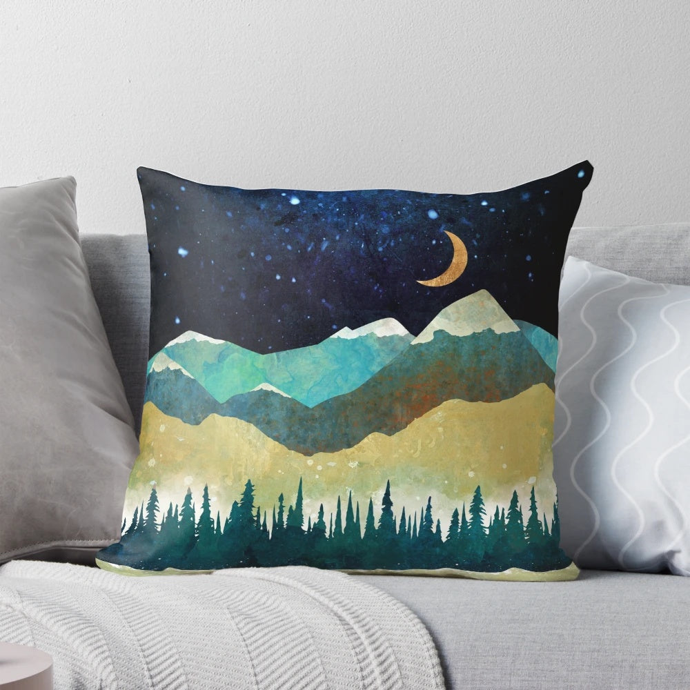 Serene snowy night landscape with blue mountains and trees on a navy blue throw pillow