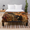 Red, black and rust colored plush blanket with an abstract marble design