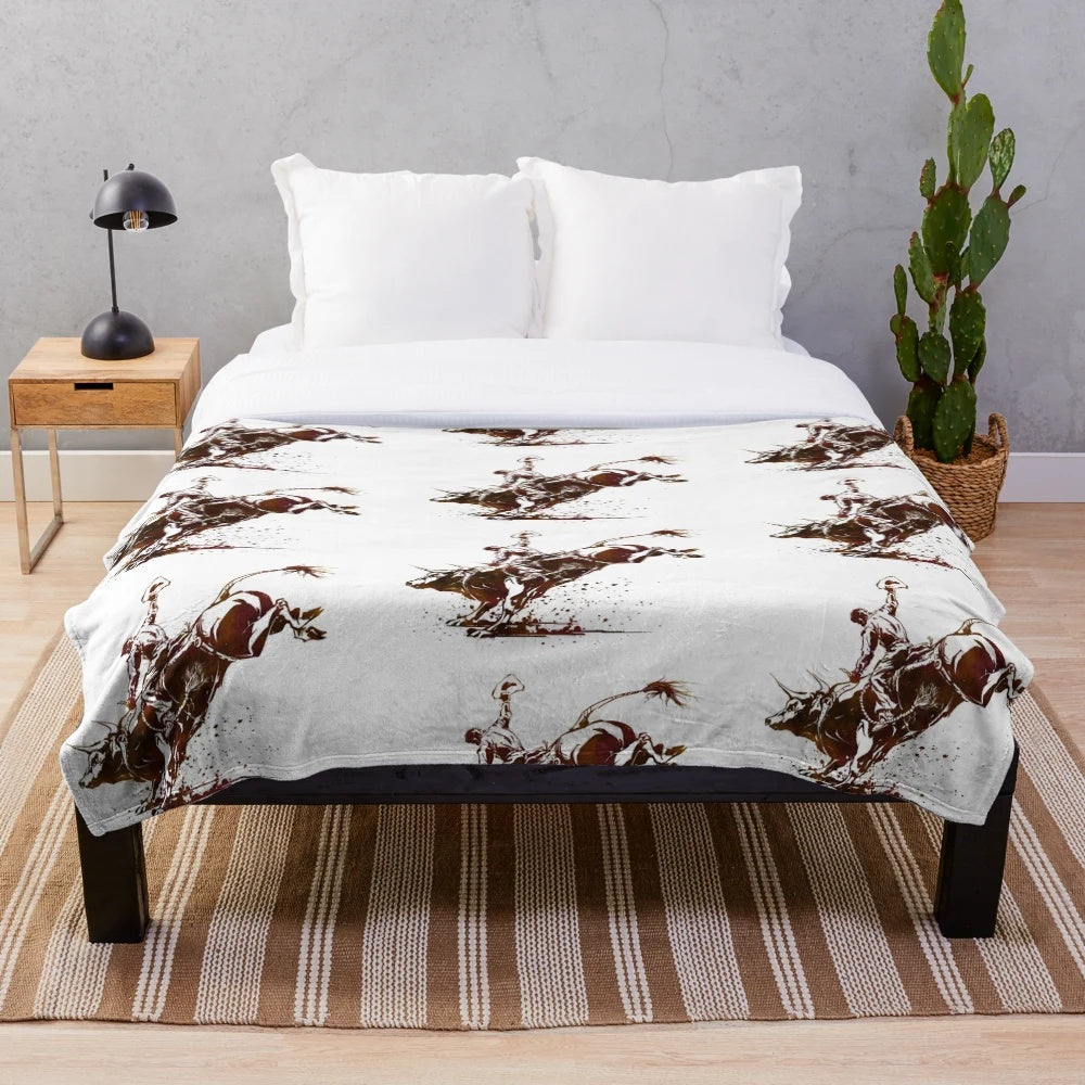 Soft plush blanket featuring a bull riding cowboy in a southwestern style