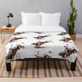 Soft plush blanket featuring a bull riding cowboy in a southwestern style