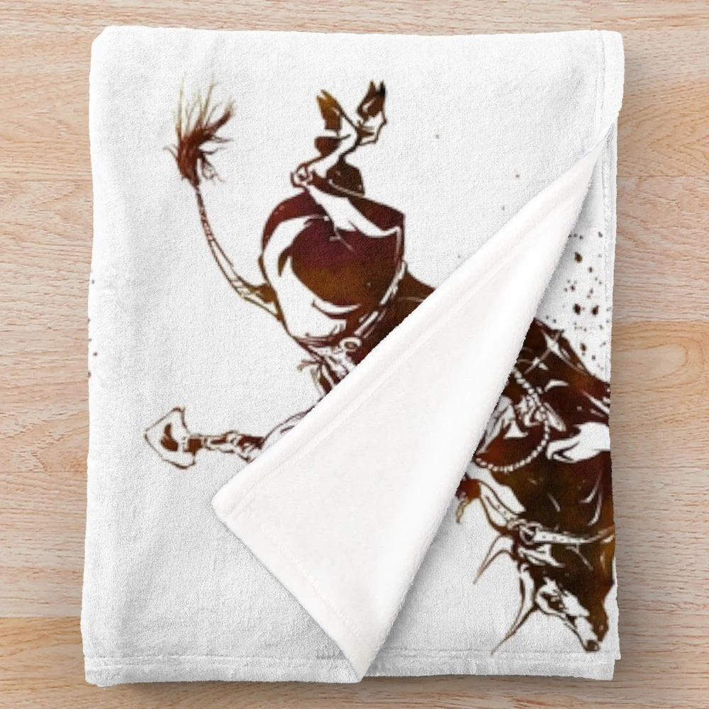Soft plush blanket featuring a bull riding cowboy in a southwestern style