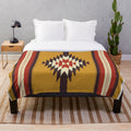 Southwestern-inspired plush blanket with tribal, ethnic pattern in yellow and gray colors