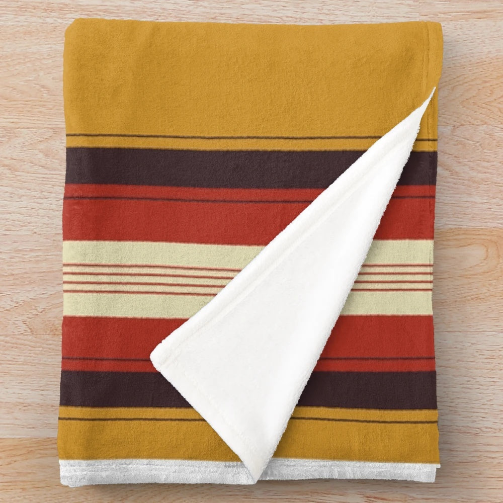 Southwestern-inspired plush blanket with tribal, ethnic pattern in yellow and gray colors