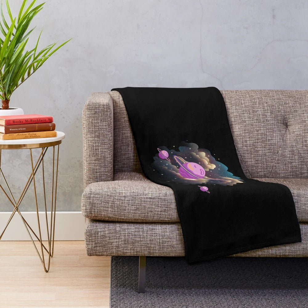 A plush and cozy space-themed blanket with a galaxy print design.