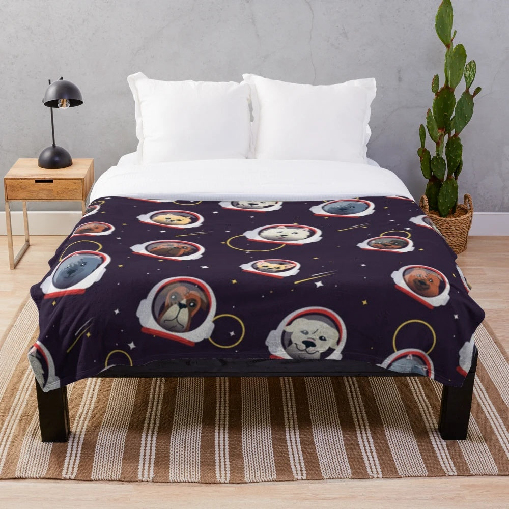 Cute plush blanket featuring space dogs in astronaut suits