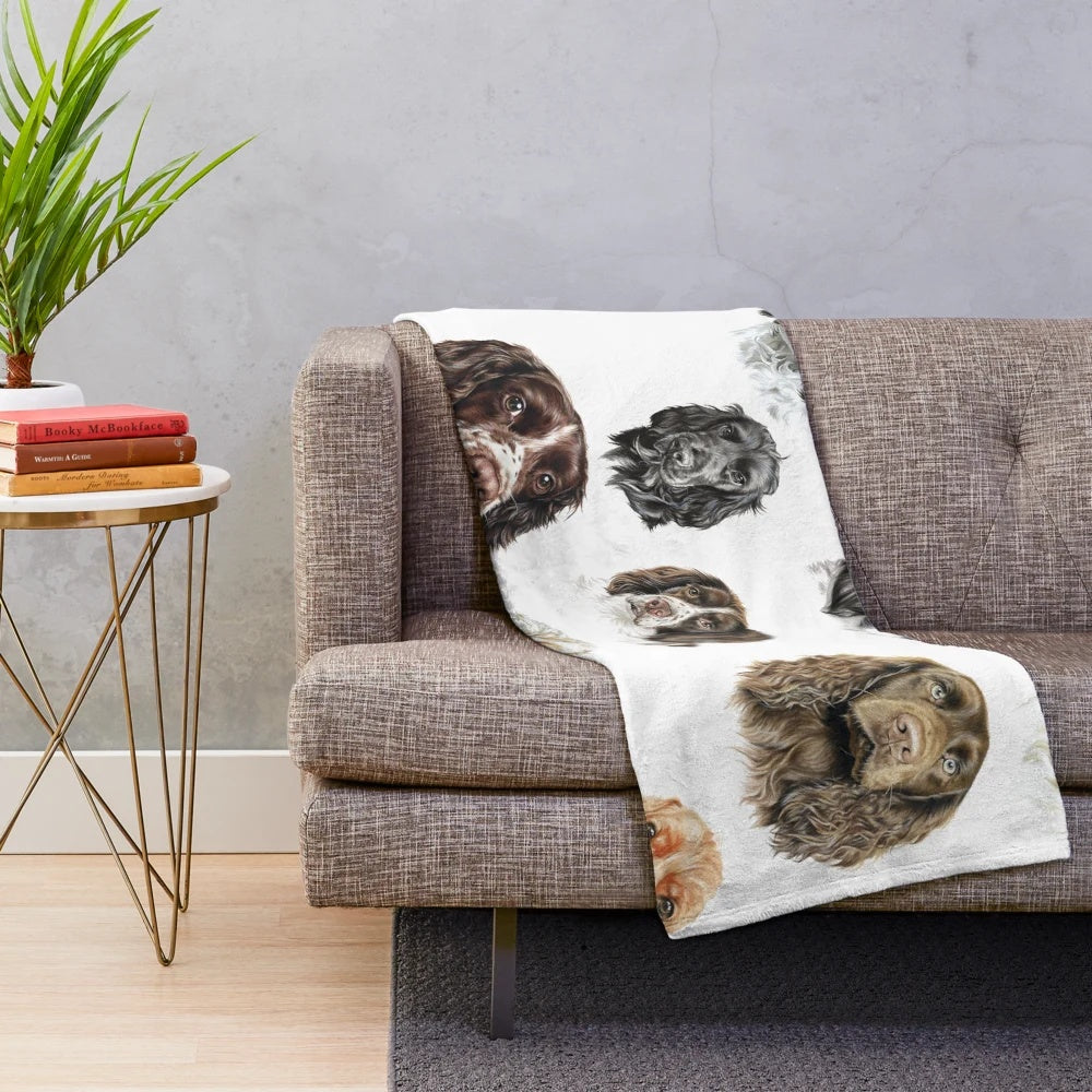 Soft and cuddly plush spaniel blanket featuring a collage of adorable dog images