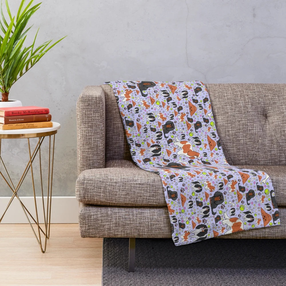 Soft, purple plush blanket featuring a pattern of cute spaniels