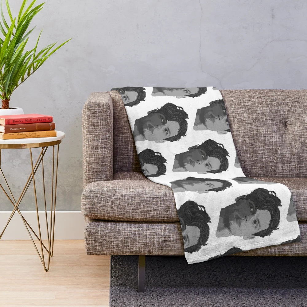 Spencer Reid from the TV show Criminal Minds depicted on a plush blanket