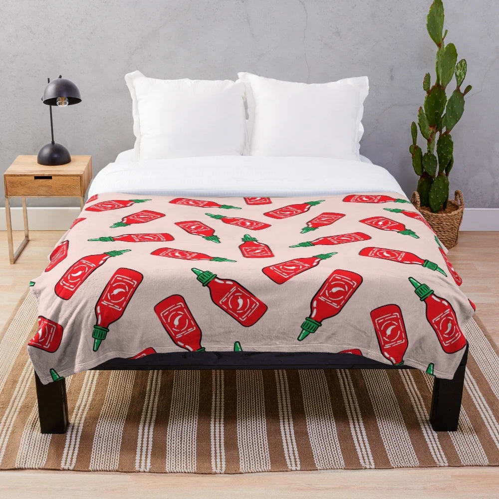 Cozy plush blanket with a spicy sauce and chili pepper design