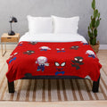 Plush blanket featuring a cartoon spider design in black and white