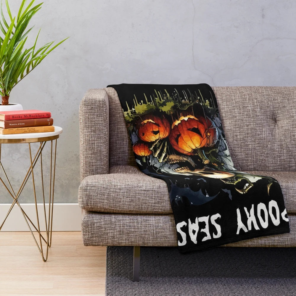 Spooky plush blanket with bats, skulls, and pumpkins for fall and Halloween
