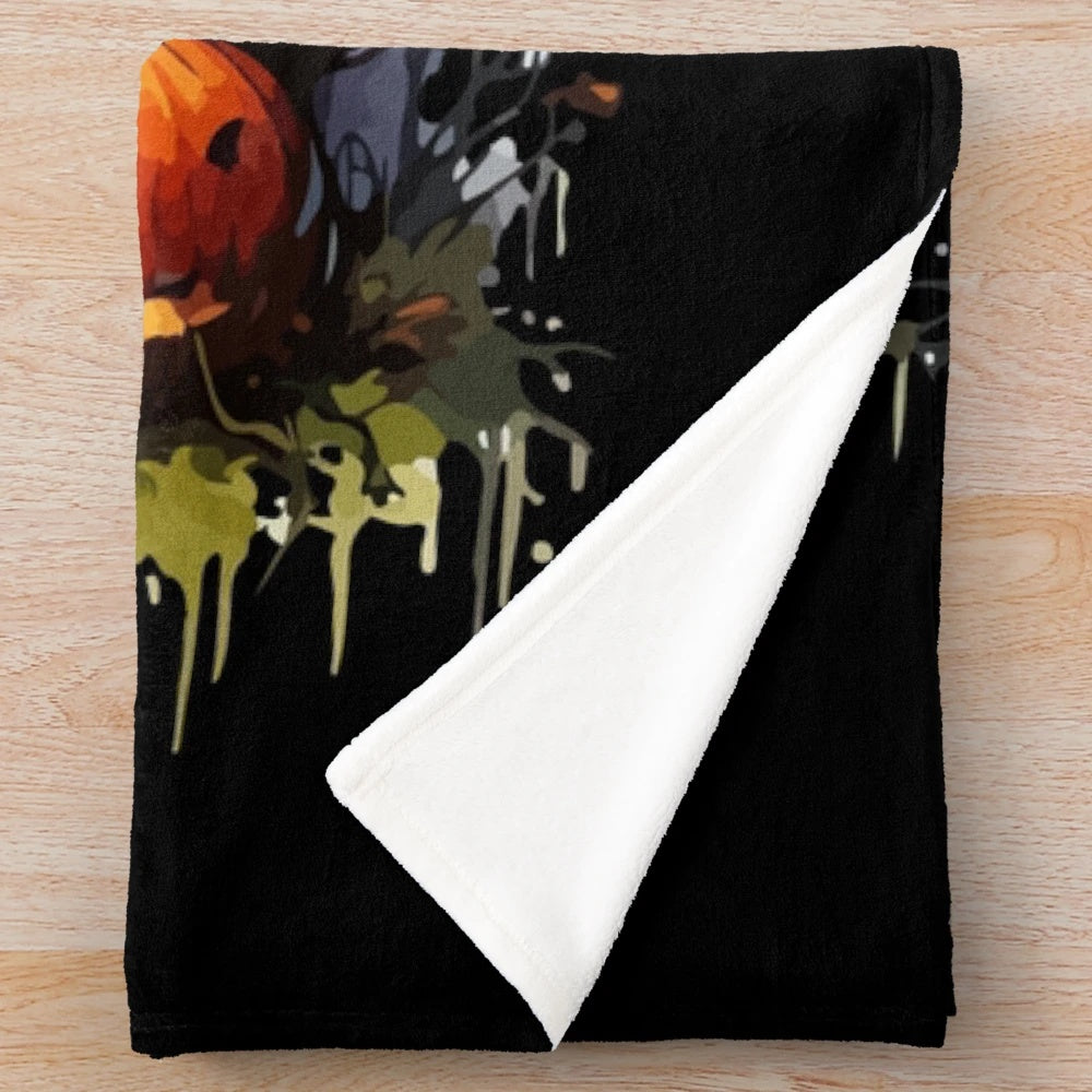 Spooky plush blanket with bats, skulls, and pumpkins for fall and Halloween