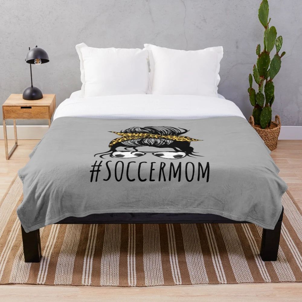Cozy plush blanket featuring a sports mom with a messy bun and leopard print design