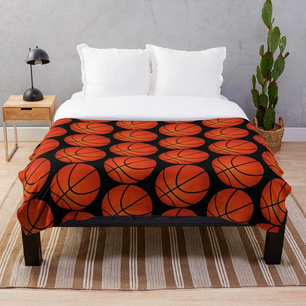 Basketball-themed plush blanket with orange and black pattern