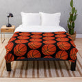 Basketball-themed plush blanket with orange and black pattern