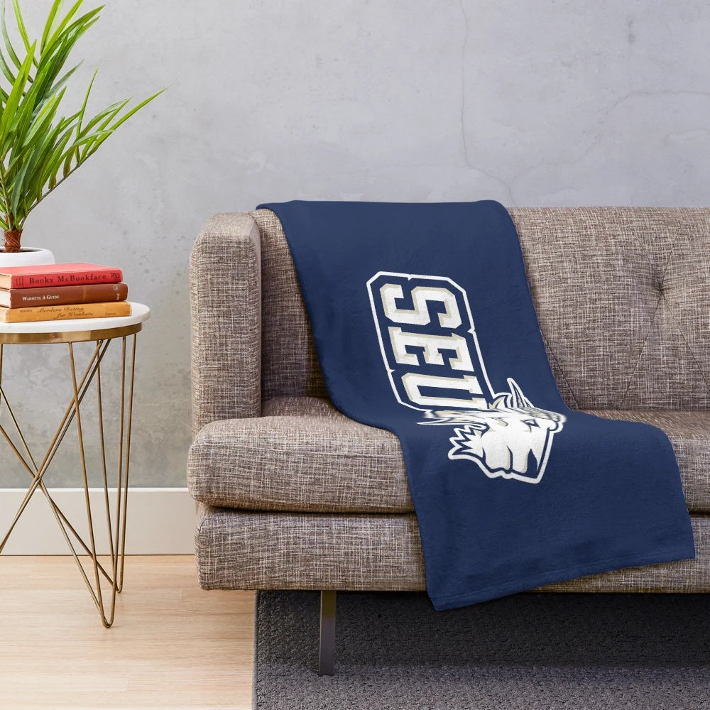 St. Edward's University logo printed on a soft, plush blanket