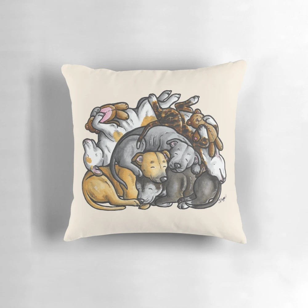 A plush pillow featuring a sleeping pile of Staffordshire Bull Terriers, a beloved bully breed dog.