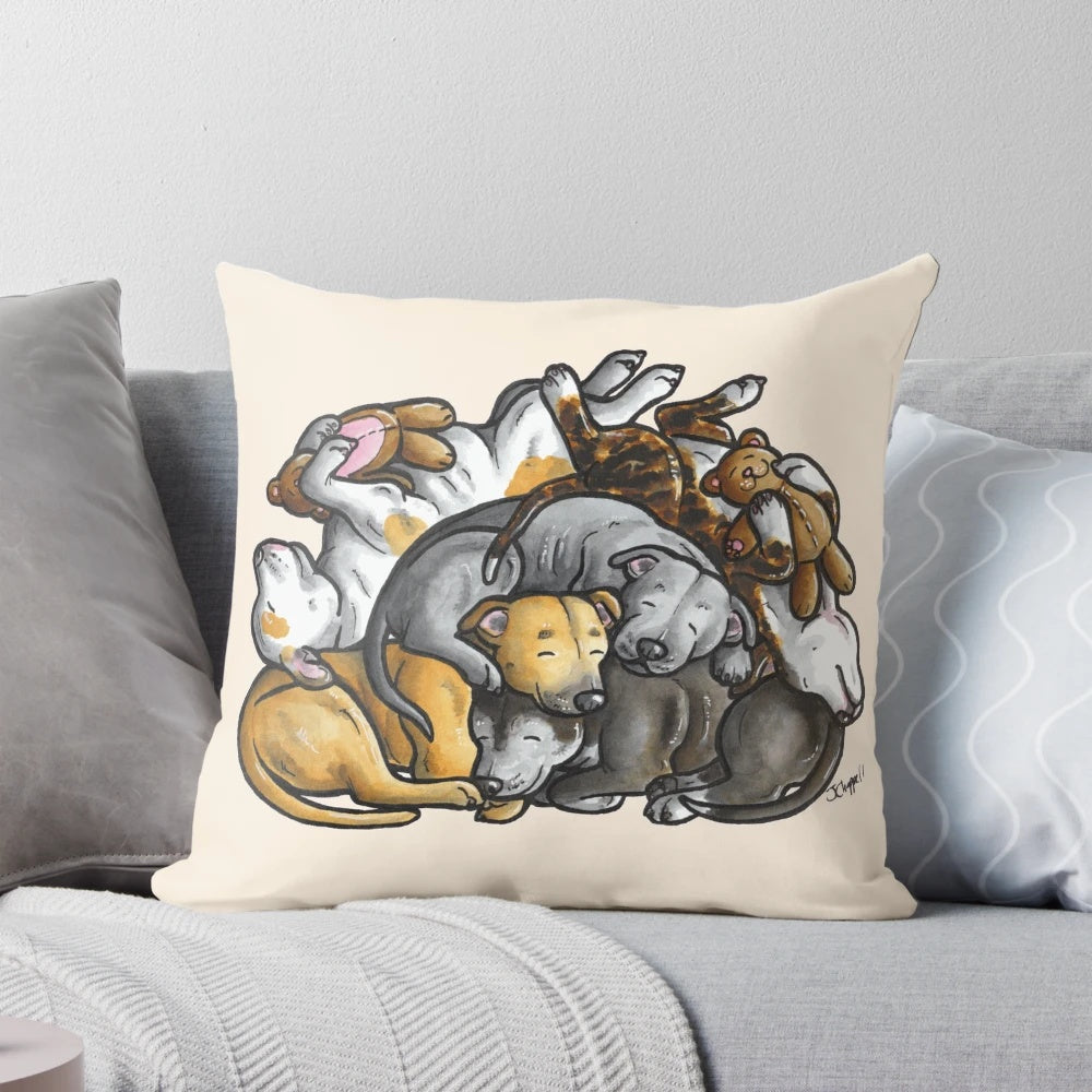 A plush pillow featuring a sleeping pile of Staffordshire Bull Terriers, a beloved bully breed dog.