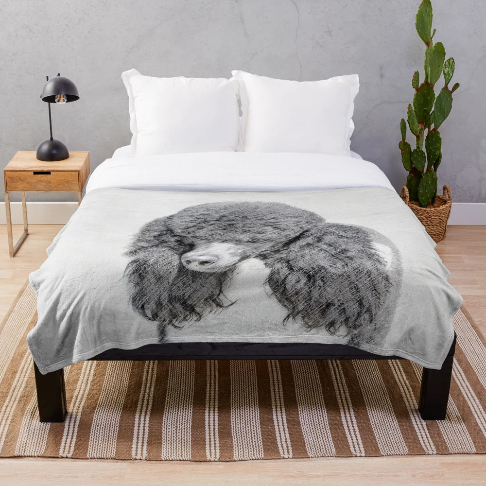 Soft and cuddly plush blanket featuring a portrait of a standard poodle in parti color