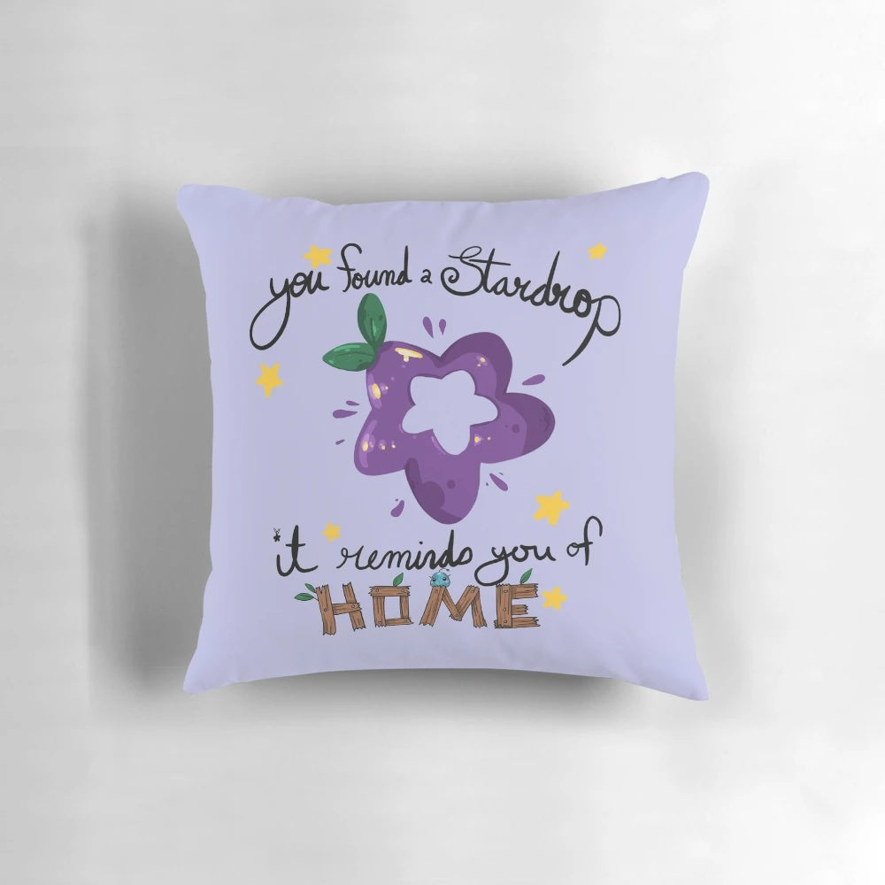 A soft, plush pillow featuring the iconic "StarDrop" from the video game Stardew Valley.