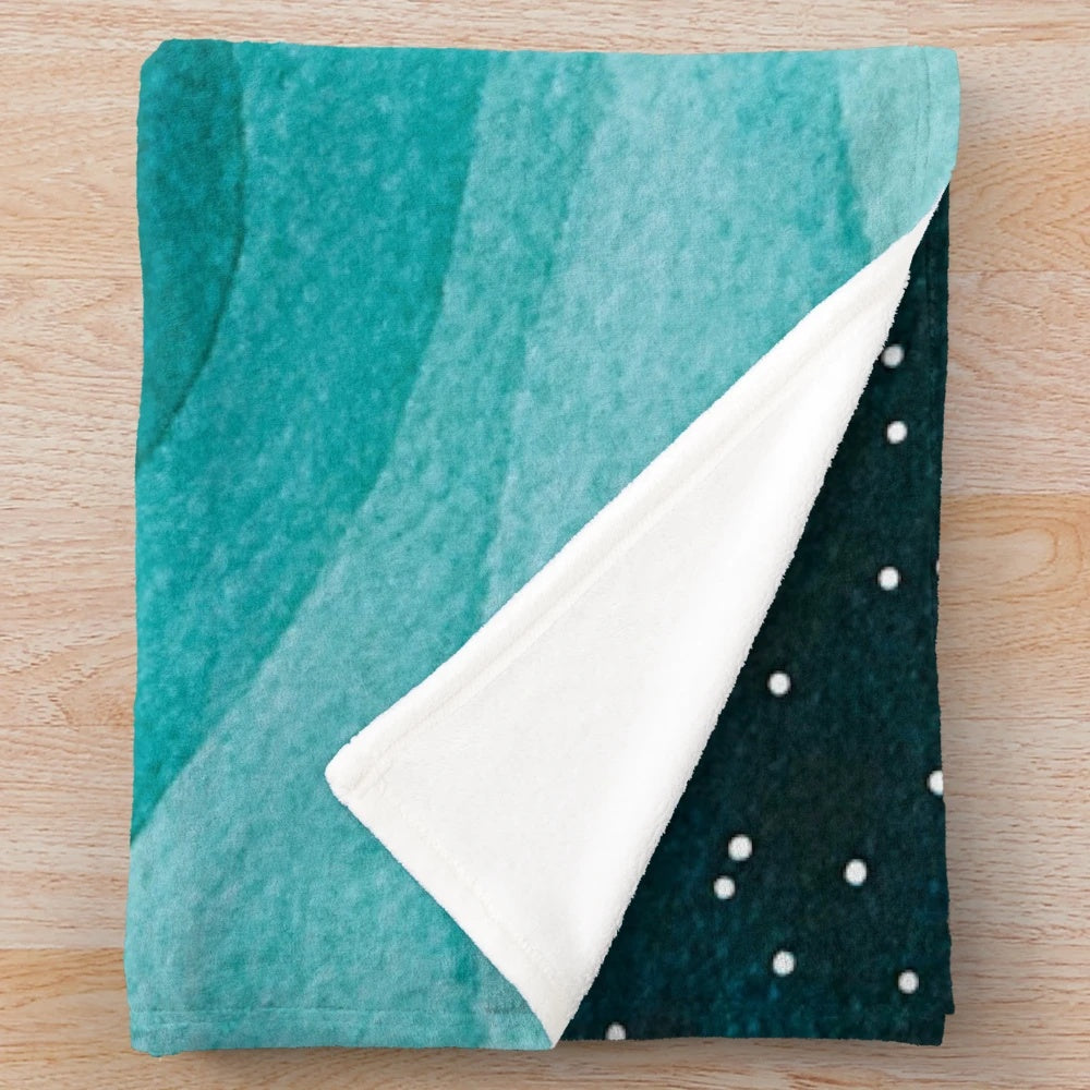 Plush blanket with a starry ocean watercolor design featuring a teal sailboat