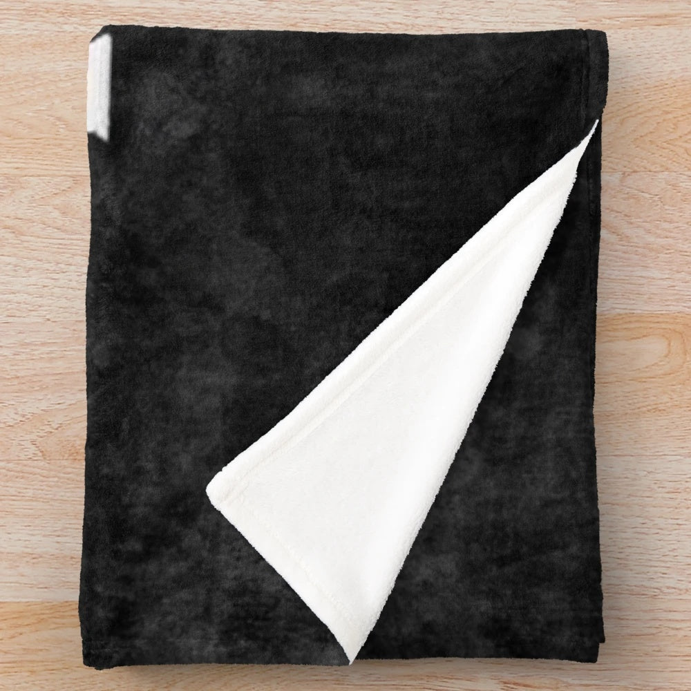 Stephen King-inspired plush blanket featuring book covers and horror movie imagery