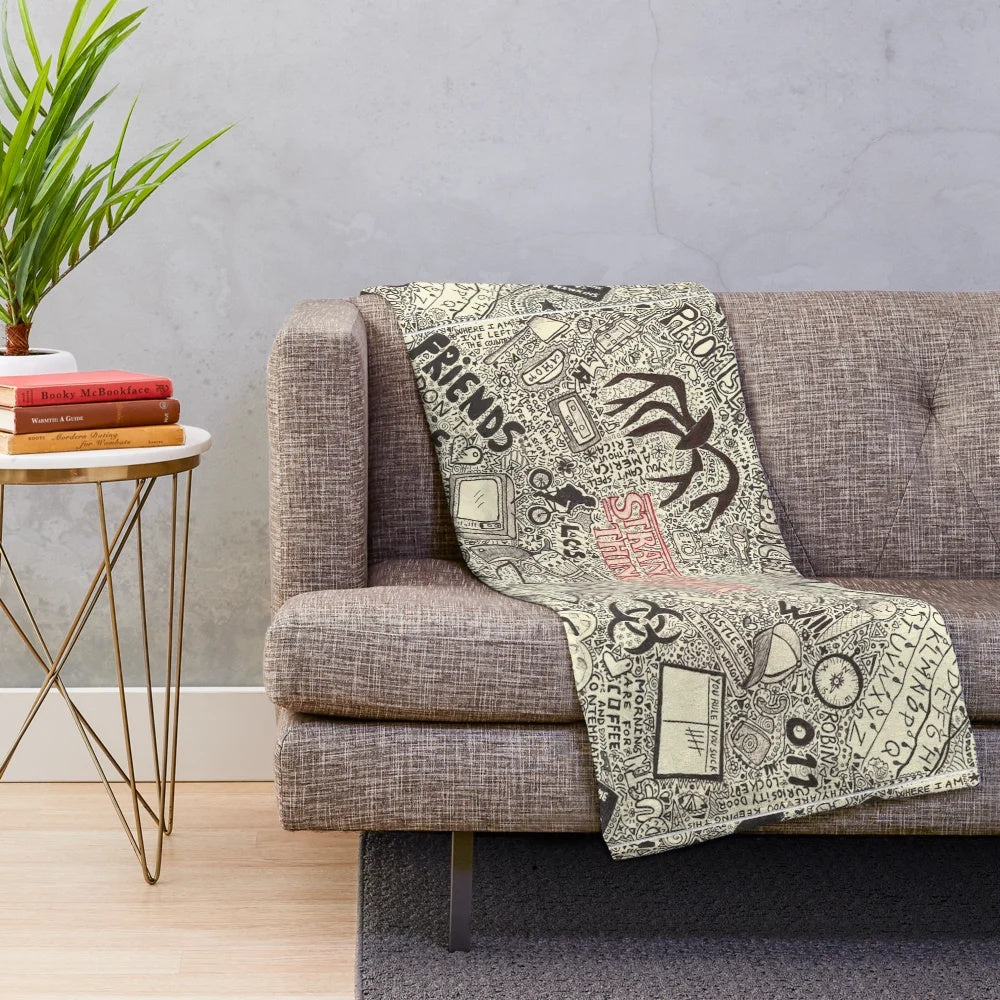 Stranger Things inspired plush blanket with various characters and references