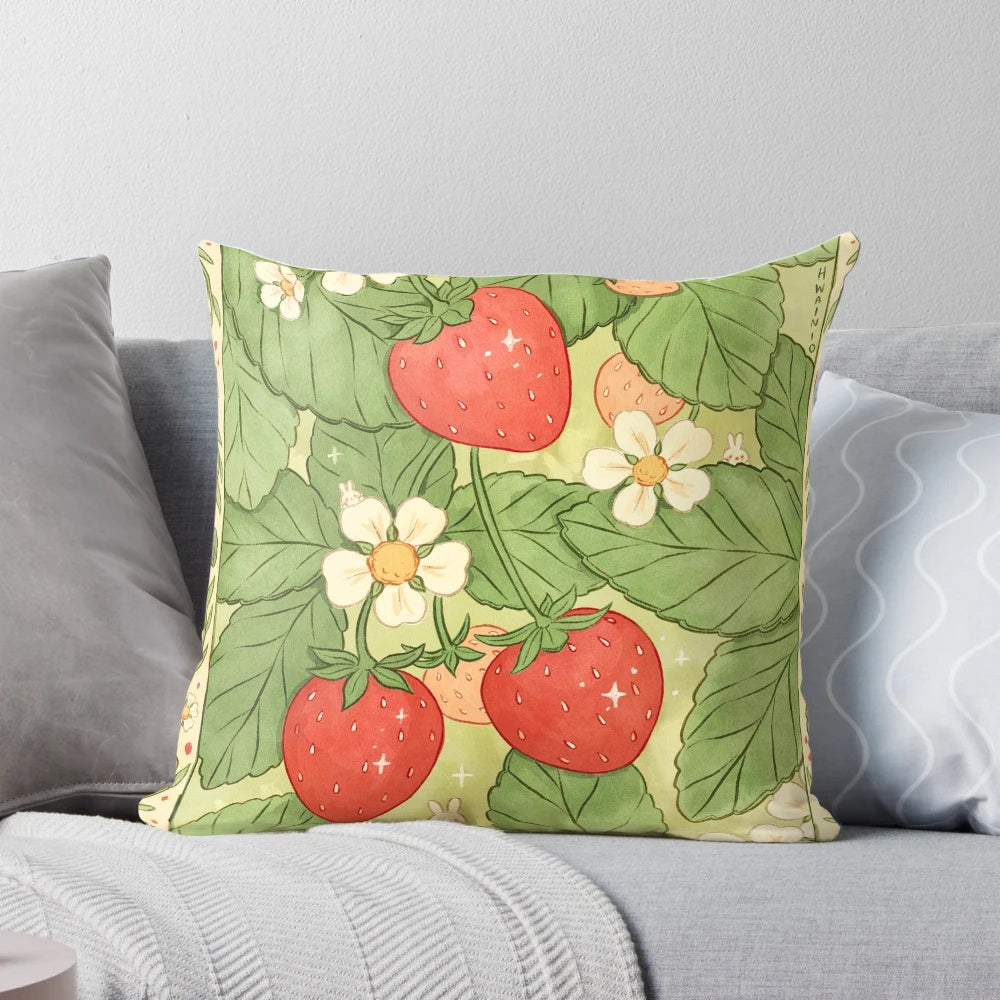 A soft, plush pillow featuring a delicate pattern of strawberries, daisies, and clovers for a charming, nature-inspired bedroom or living space.