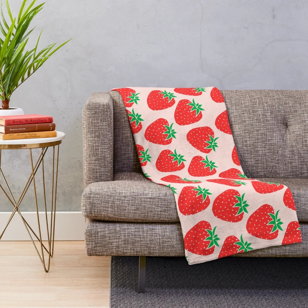 Soft and plush strawberry patterned blanket for a cozy and cute home