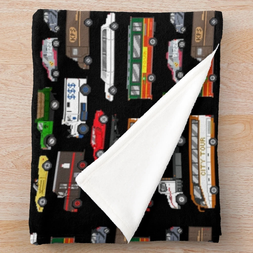 Plush blanket featuring various street vehicles for kids
