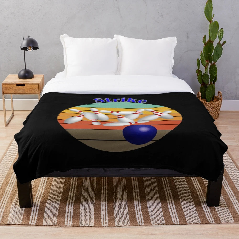 Soft and cozy plush blanket featuring a bowling strike design